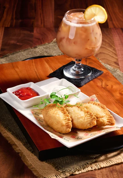 Khuushuur (mongolian fried beef dumplings, garlic yogurt sauce)
